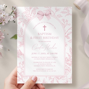May include: A baptism and first birthday invitation with a floral design in pink. The text reads "Baptism & First Birthday" and includes the name "Caroline Hudson" and event details. A pink bow and cross are at the top.