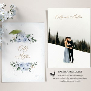 May include: A wedding invitation with a watercolor design featuring blue flowers and greenery. The invitation reads "Cathy & Matthew" in gold script. The back of the invitation features a photo of a couple in a snowy forest.