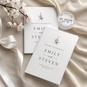 Puede incluir: Dos programas de boda blancos con texto negro, con los nombres "Emily y Steven". Una ramita de flores blancas y una cinta blanca están dispuestas sobre una tela beige. Una pegatina circular dice "Free Demo Link Try Before You Buy."