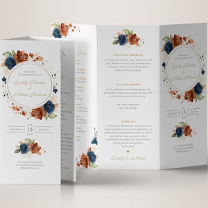 Puede incluir: Un programa de boda de tres pliegues con un diseño floral de acuarela en tonos azules, naranjas y blancos. El programa incluye los nombres de la novia y el novio, Emily Burton y Adam Hudson, la fecha y hora de la ceremonia, y la ubicación de la ceremonia. El programa también incluye una sección para la fiesta de bodas, una sección para en memoria cariñosa, y un mensaje de agradecimiento de la novia y el novio.