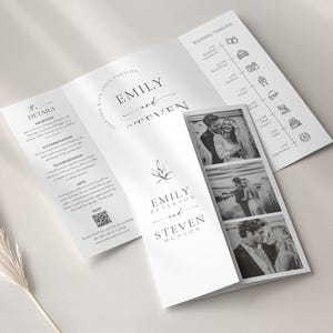 May include: A tri-fold wedding invitation with the names "Emily" and "Steven" in elegant script. The invitation includes a wedding timeline, details, and black and white photos of the couple. A QR code is also included.