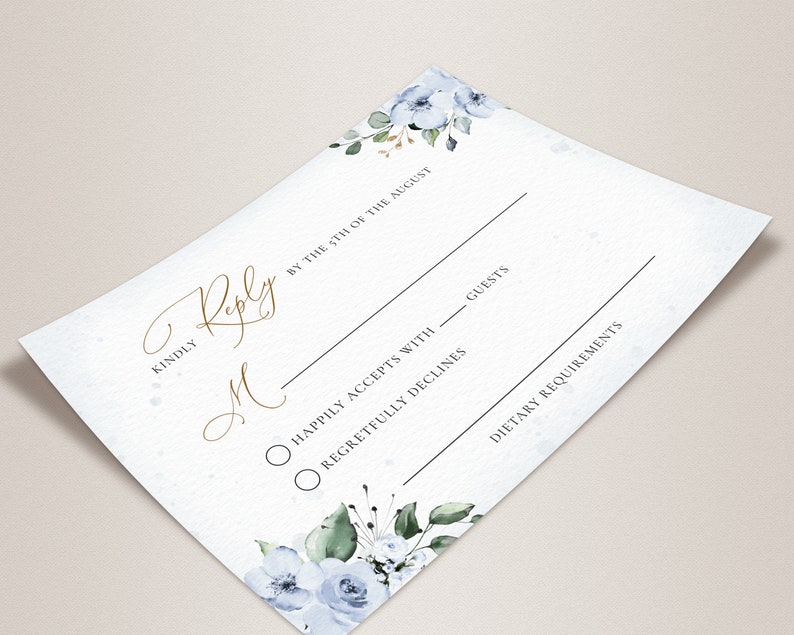 May include: A white RSVP card with blue floral accents. The card has a gold script font that says "Kindly Reply by the 5th of August". There are two radio buttons with the text "Happily Accepts with ___ guests" and "Regretfully Declines". The card also has a section for "Dietary Requirements".