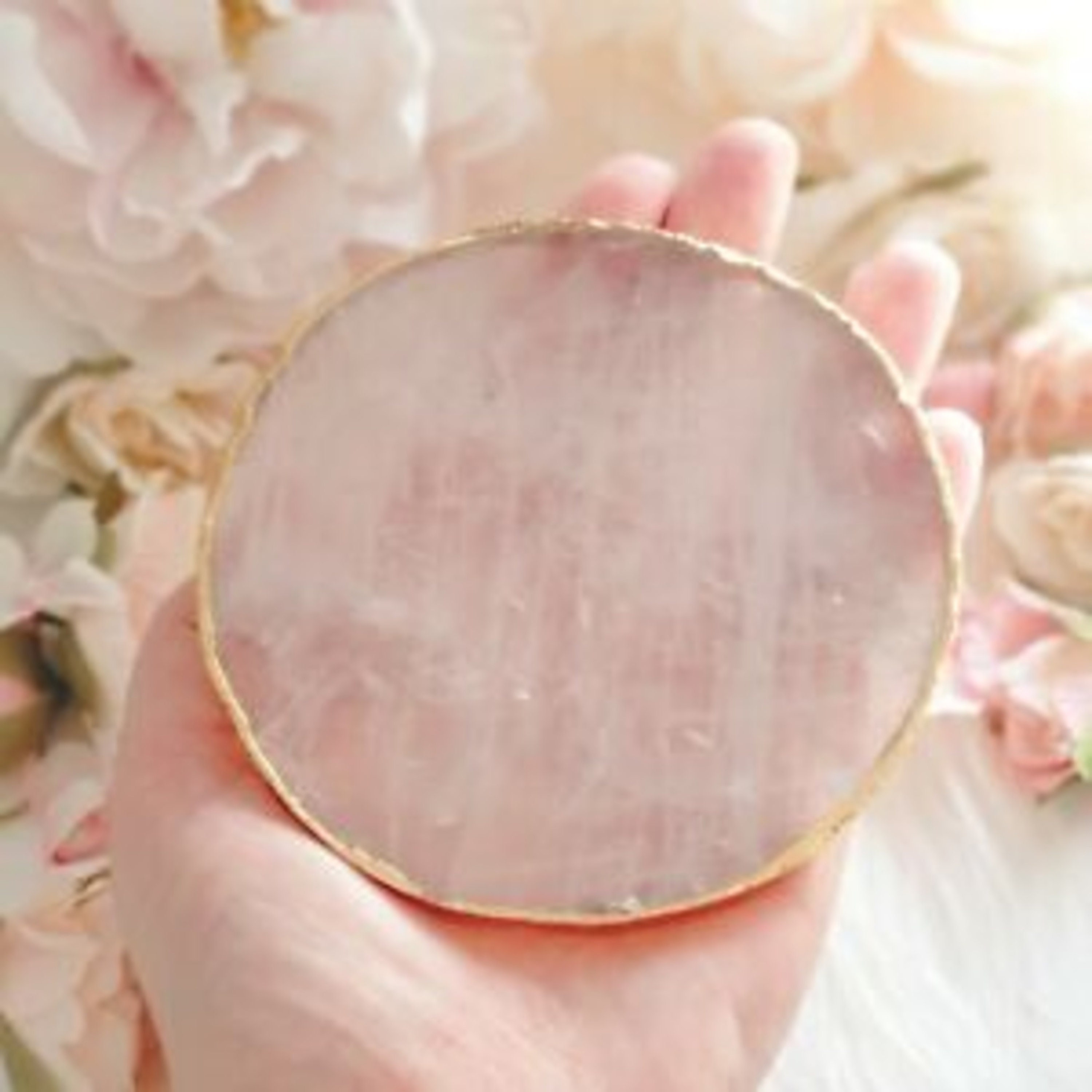 Rose Quartz slice drink coasters with gold electroplating around the
