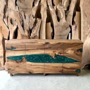 May include: A wooden cabinet with four doors and a green epoxy resin inlay. The cabinet has a natural wood finish and is made of solid wood.