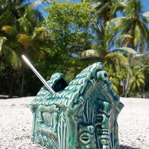 Colorful grass hut Tiki mug perfect for serving tropical cocktails and adding island vibes.