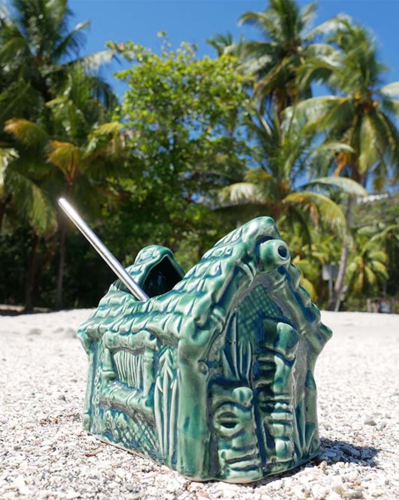 Colorful grass hut Tiki mug perfect for serving tropical cocktails and adding island vibes.