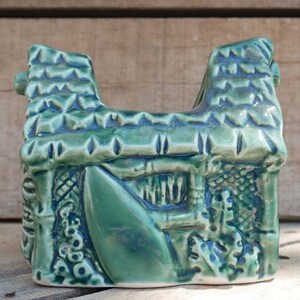 Small grass hut style Tiki mug, perfect for sipping exotic drinks and enhancing your Tiki collection.