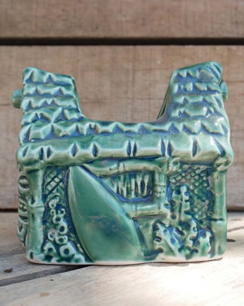 Small grass hut style Tiki mug, perfect for sipping exotic drinks and enhancing your Tiki collection.