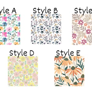 May include: Five square fabric swatches labeled Style A through Style E. Style A features pink and blue flowers. Style B shows dark botanical sprigs. Style C displays purple and orange blossoms. Style D has dense yellow flowers. Style E shows large orange petals.