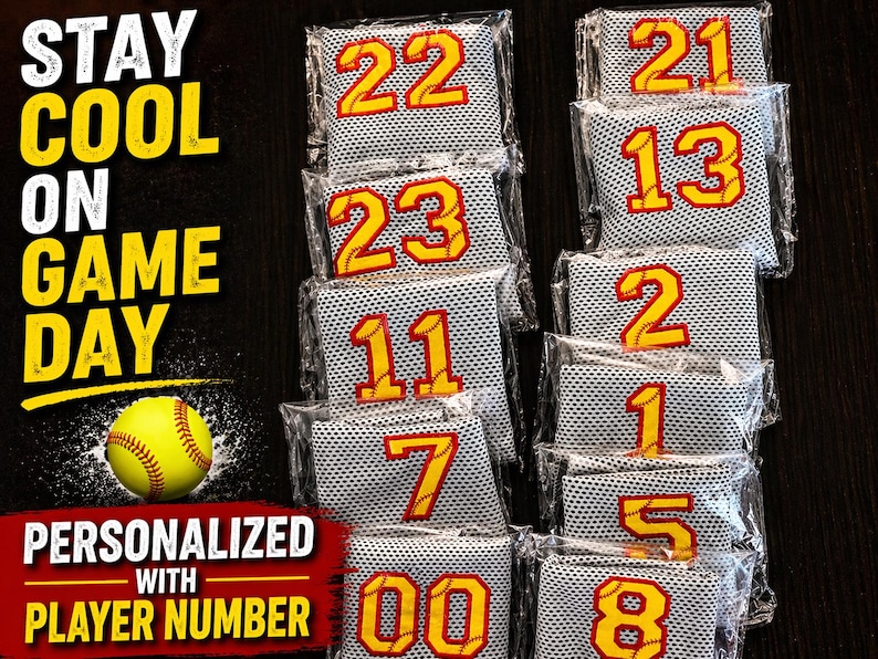 May include: Softball-themed game day accessories. The image shows several personalized cooling towels with player numbers in yellow and red. The text "STAY COOL ON GAME DAY" and "PERSONALIZED WITH PLAYER NUMBER" are also visible.