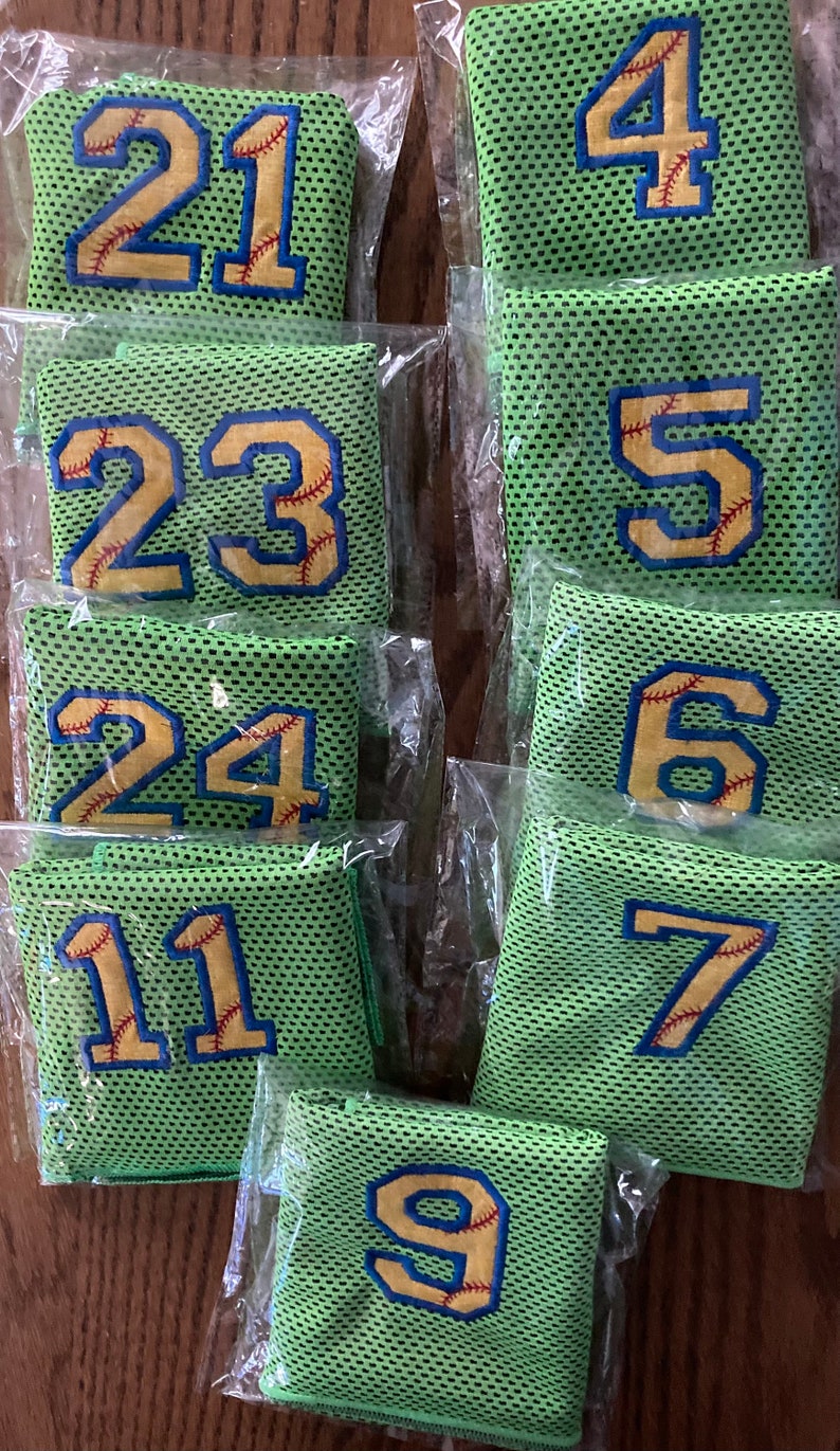 Lime green Softball cooling towels outlined in navy .  Softball cooling towels have the yellow to represent the softball.  If you don't select an outline stitch color, I will choose something that looks good with the towel color you selected.