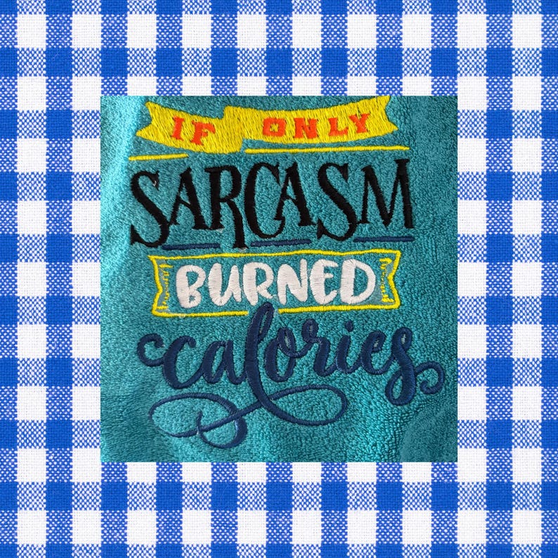 May include: Teal hand towel with embroidered text: "IF ONLY SARCASTM BURNED calories." The text is in black, white, and yellow. The towel is surrounded by a blue and white checkered pattern.