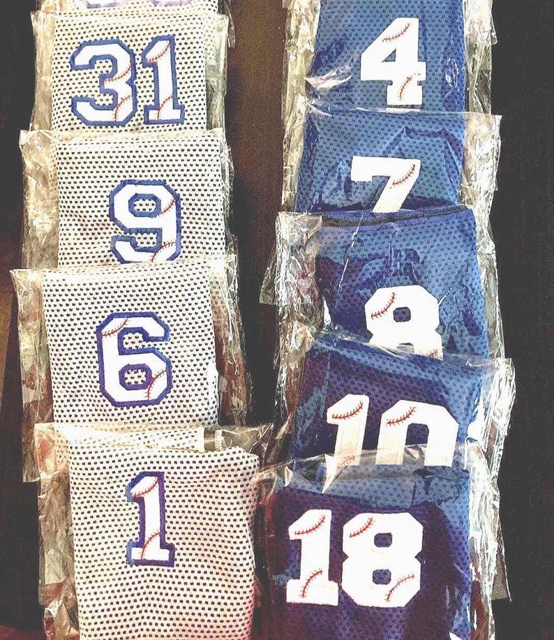 gray baseball cooling towel outlined in Royal Blue and Royal blue cooling towel outlined in white.
