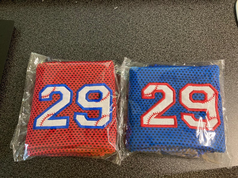 Red baseball cooling towel outlined in royal blue. Royal blue baseball cooling towel outlined in red.  Some people choose to split team orders into two colors and outline in the other thread color for variety.