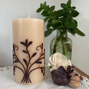 Tree of life candle made with recycled beeswax and decorated with wax.