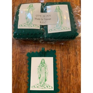 May include: Green felt prayer cards with a white image of a religious figure. The cards are packaged in clear plastic. The text on the packaging reads "Q'TY: 20 PCS Made In Taiwan R.O.C."