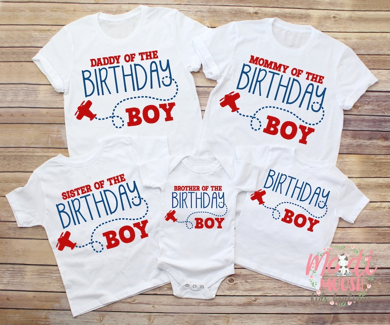 May include: Set of four white t-shirts with red and blue text that says "Daddy of the Birthday Boy", "Mommy of the Birthday Boy", "Sister of the Birthday Boy", and "Brother of the Birthday Boy". Each shirt features a red aeroplane with a blue dotted line.