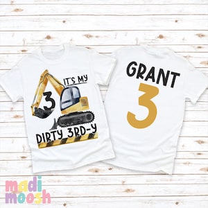 May include: White t-shirt with a yellow excavator graphic and the text "It's my 3rd-y" on the front. The back of the shirt has the name "GRANT" and the number "3" in yellow.