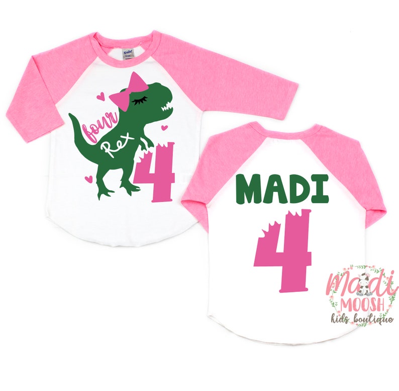 May include: Two white and pink baseball shirts with a green dinosaur graphic and the text "four Rex 4" on the front and the text "MADI 4" on the back.