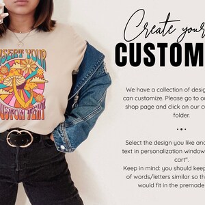 May include: A beige t-shirt with a retro-style mushroom graphic and the text "Insert Your Custom Text". The shirt is being modeled by a person wearing a denim jacket and black pants.
