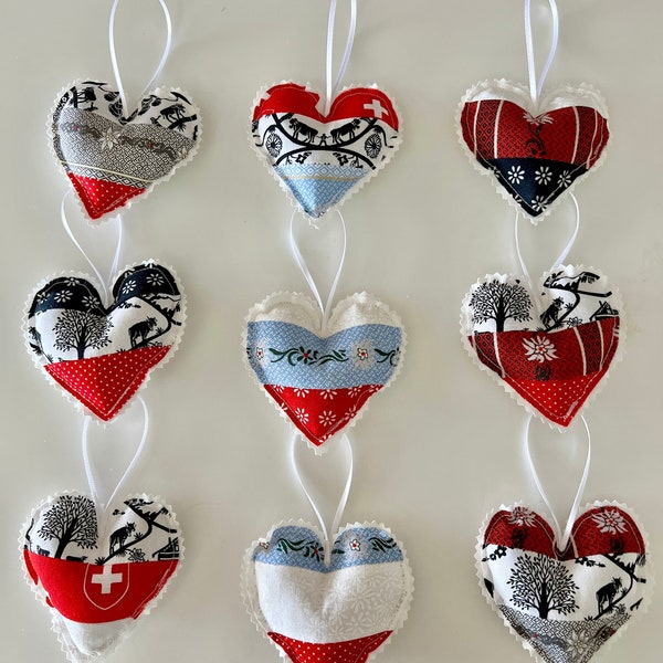 3 fabric hearts made with traditional Swiss Edelweiss and Scherenschnitt fabric. Makes a lovely gift for friend of Switzerland.