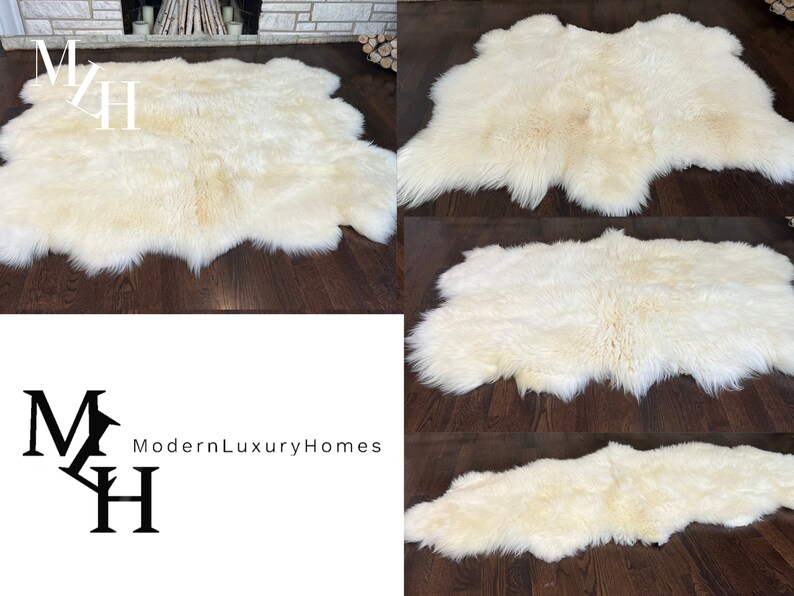 May include: A white sheepskin rug with a soft, fluffy texture. The rug is laid out on a hardwood floor.
