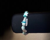 Aquamarine bracelet with quartz crystal charm