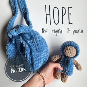 May include: Crochet pattern for a blue drawstring bag and a small blue hooded amigurumi doll. The pattern is called "HOPE the original & pouch".