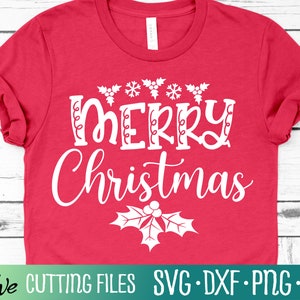 May include: Red t-shirt with white text that says "Merry Christmas" with a holly sprig underneath.