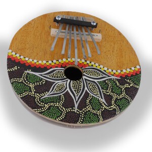 Kalimba thumb piano Sansula percussion instrument made of coconut and wood