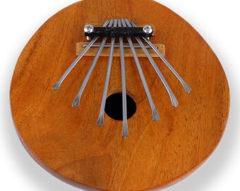 Kalimba thumb piano Sansula percussion instrument made of coconut and wood