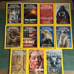 May include: A collection of ten National Geographic magazine covers featuring a variety of topics, including wolves, volcanoes, diamonds, refugees, mummies, D-Day, bald eagles, meerkats, death on the Nile, skin, and owls.