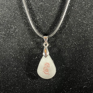 Small resin pendant with red dragon