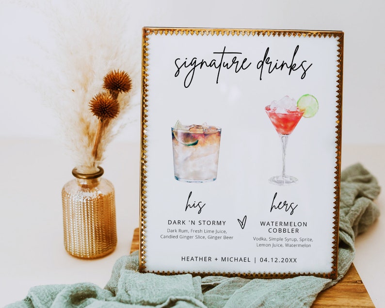 May include: A gold framed sign with the words "signature drinks" at the top. The sign lists two cocktails, one labeled "his" and the other labeled "hers". The "his" cocktail is called "Dark 'N Stormy" and the "hers" cocktail is called "Watermelon Cobbler". The sign also includes the names "Heather + Michael" and the date "04.12.20XX".