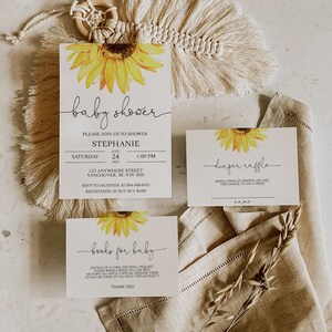 May include: A set of three cards for a baby shower. The cards are decorated with sunflowers and feature the text "baby shower", "diager raffle", and "books for baby".