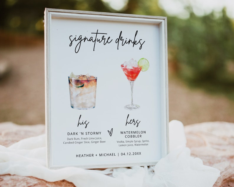May include: A white sign with the words "signature drinks" written in black cursive. The sign has two watercolor illustrations of cocktails, one labeled "his" and the other labeled "hers". The text below the illustrations lists the ingredients for each drink. The bottom of the sign has the text "HEATHER + MICHAEL | 04.12.20XX".