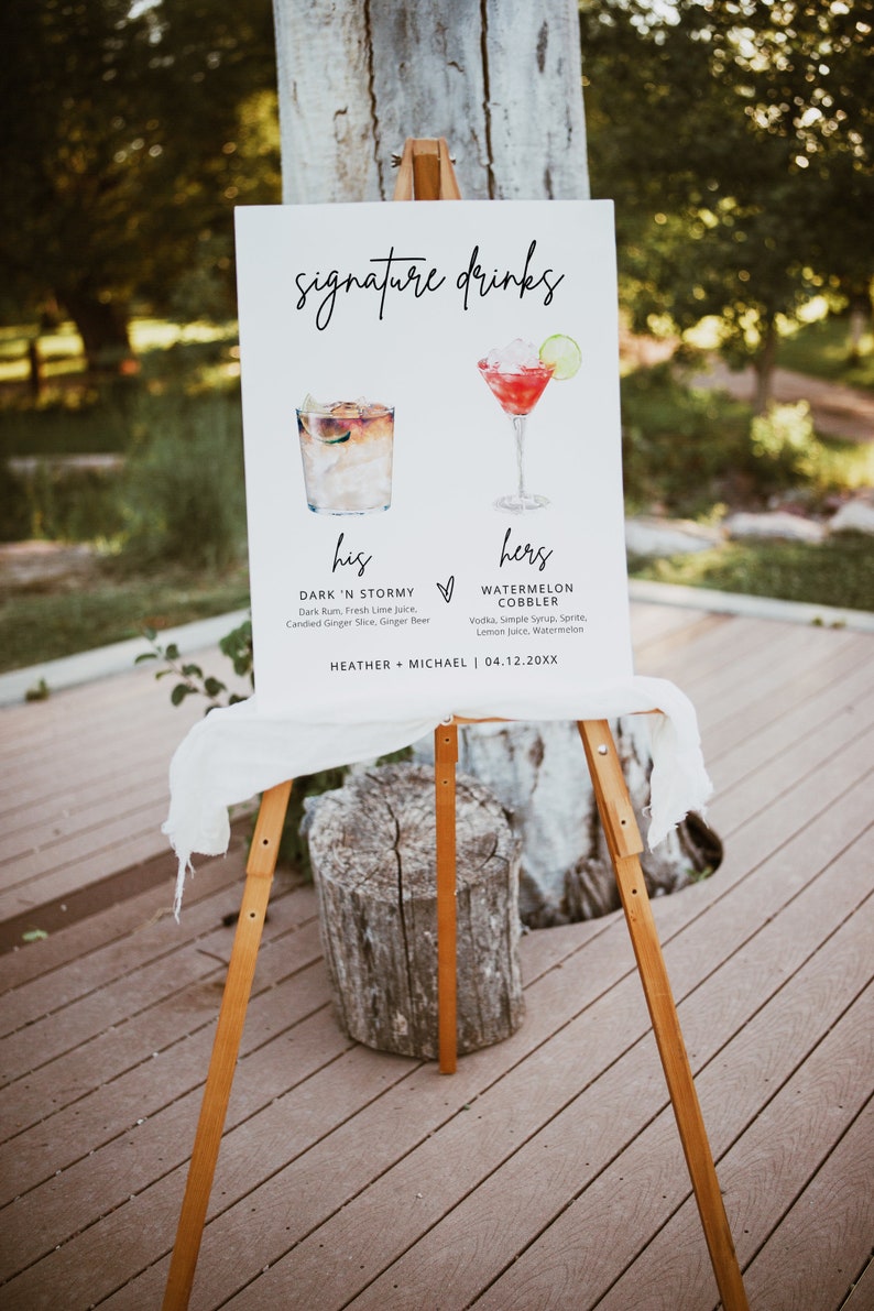 May include: A white sign with black text and illustrations of two cocktails. The sign reads "signature drinks" and lists the ingredients for "his" drink, "Dark 'N Stormy", and "hers" drink, "Watermelon Cobbler". The sign also includes the names "Heather + Michael" and the date "04.12.20XX".