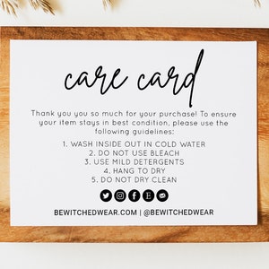 Puede incluir: Una tarjeta de cuidado blanca con texto negro sobre un fondo de madera. La tarjeta proporciona instrucciones para lavar y cuidar un artículo. El texto dice "care card", "Thank you you so much for your purchase! To ensure your item stays in best condition, please use the following guidelines:", "1. WASH INSIDE OUT IN COLD WATER", "2. DO NOT USE BLEACH", "3. USE MILD DETERGENTS", "4. HANG TO DRY", "5. DO NOT DRY CLEAN", "BEWITCHEDWEAR.COM | @BEWITCHEDWEAR".