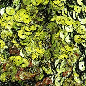 May include: Close-up of a pile of shiny, lime green sequins. Each sequin is circular with a ridged edge and a hole in the center. The sequins are scattered, creating a textured, reflective surface.