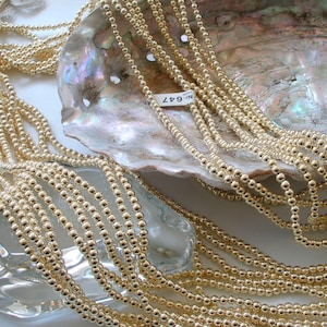 Japanese Gold Round (2mm thru 12mm) Faux Pearl Beads Strands (Light, Medium & Intense Gold)
