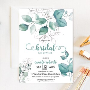 May include: A white invitation card with a teal floral design and the words "bridal shower." The card includes event details: date, time, location, and RSVP information. Decorative elements include eucalyptus leaves and silver accents.