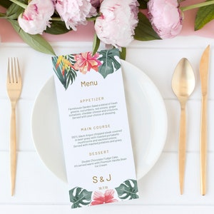 May include: A wedding menu with a tropical theme. The menu is printed on white cardstock with a floral design and the text "Menu", "Appetizer", "Farmhouse Garden Salad", "Main Course", "100% Angus Chopped Steak", "Dessert", "Double Chocolate Fudge Cake", "S&J", "18.7.19".