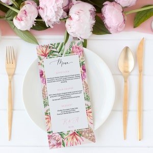 May include: A white plate with gold cutlery and a menu card featuring a floral design. The menu card has the word "Menu" written in cursive and lists the appetizers, main course, and dessert. The menu card also has the text "R.O.T.A. 01.12.18" at the bottom.