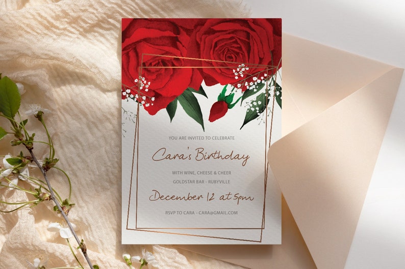 May include: A white invitation card with a gold frame and red roses. The text reads "You are invited to celebrate Cara's Birthday with wine, cheese & cheer Goldstar Bar - Rubyville December 12 at 5pm RSVP to Cara - cara@gmail.com"