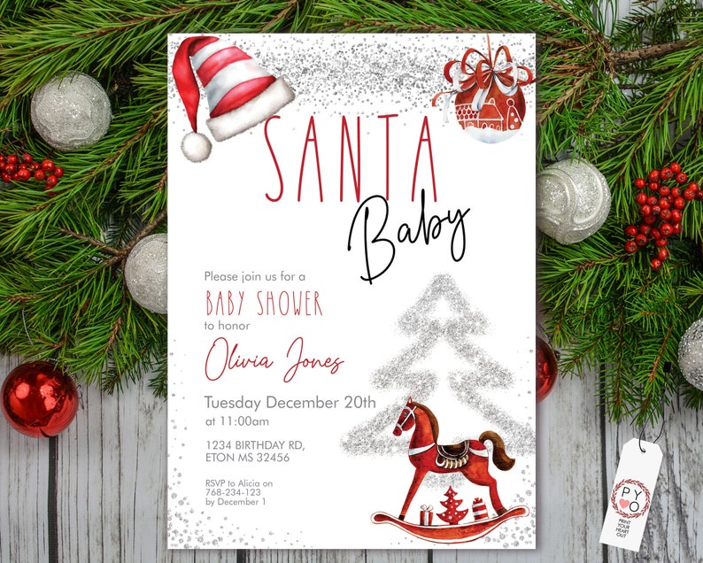 May include: A festive baby shower invitation with the words "SANTA Baby" in red and black script. The invitation features a Santa hat, a rocking horse, and a Christmas tree design, perfect for a holiday-themed baby shower.
