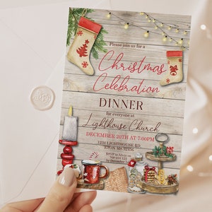 May include: A Christmas Celebration Dinner invitation with a rustic wood background. The invitation features festive illustrations of stockings, a candle, and a mug. The text reads "Christmas Celebration Dinner" and includes event details.