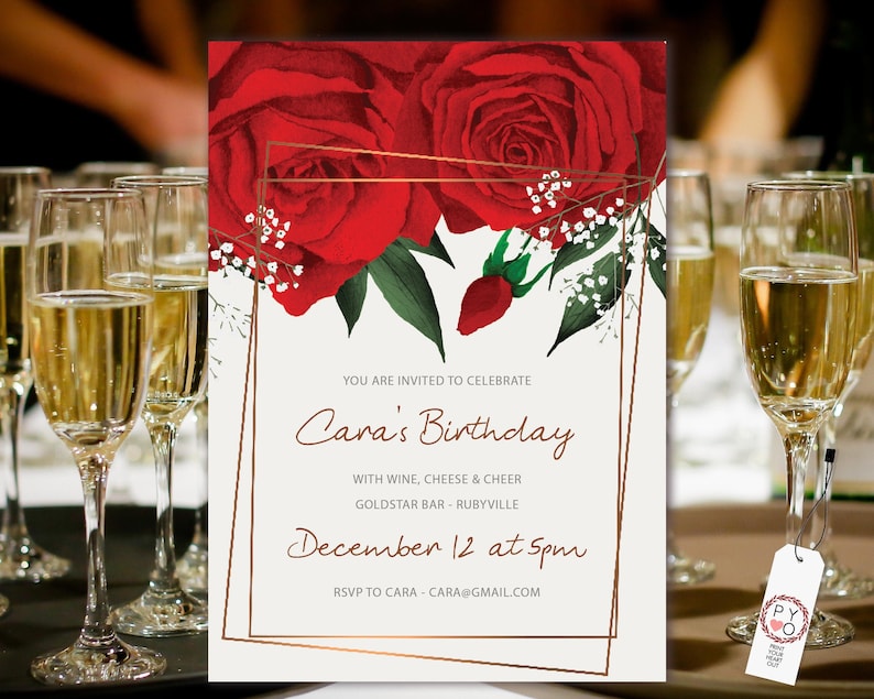 May include: A red and white floral birthday invitation with a gold frame. The invitation reads "You are invited to celebrate Cara's Birthday with wine, cheese & cheer Goldstar Bar - Rubyville December 12 at 5pm RSVP to Cara - cara@gmail.com"