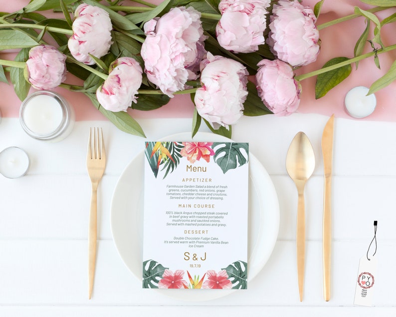 May include: A tropical-themed wedding menu card with a floral design. The menu includes appetizers, main course, and dessert. The card is printed on white cardstock and features a gold border. The text on the card reads "Menu", "Appetizer", "Farmhouse Garden Salad", "Main Course", "100% Black Angus Chopped Steak", "Dessert", "Double Chocolate Fudge Cake", "Ice Cream", "S & J", "19.7.19".