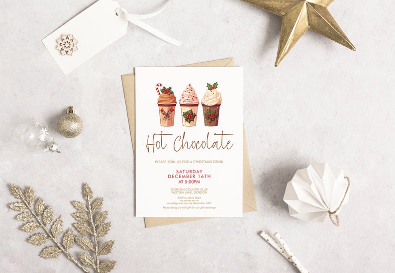 May include: A Christmas-themed invitation with the words "Hot Chocolate" in a script font. The invitation features illustrations of three hot chocolate cups with whipped cream and festive toppings. Decorative elements include a gold star, ornaments, and a snowflake.