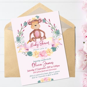 May include: Pink baby shower invitation with a watercolor illustration of a monkey wearing a flower crown. The text reads "Baby Shower" and "Please join us" in a pink and white font. The invitation also includes the name "Olivia James" and the date and time of the shower.